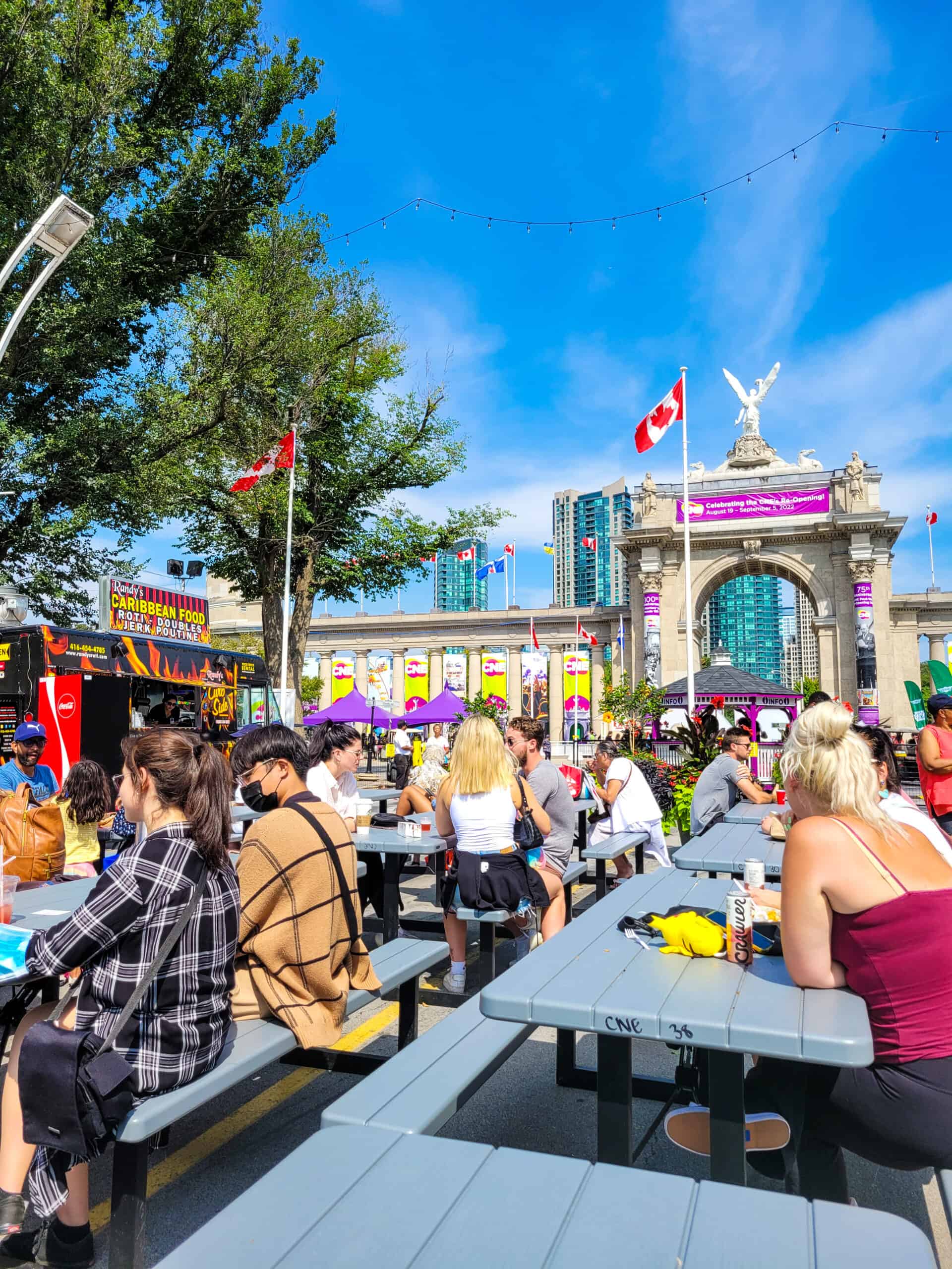 The food truck park at the Canadian National Exhibition with the Princes Gates in the background.